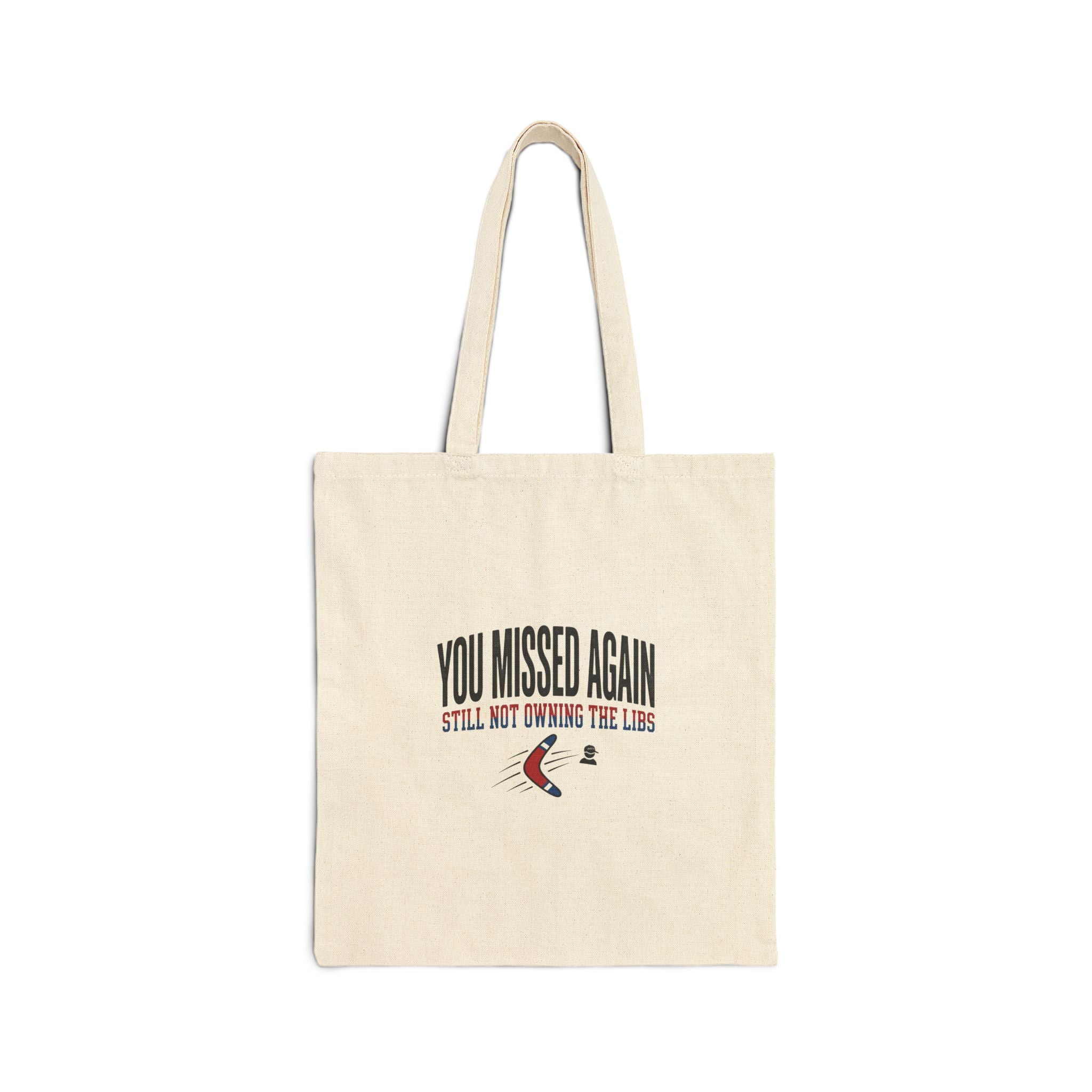 A natural canvas tote bag featuring the text You Missed Again Still Not Owning The Libs.