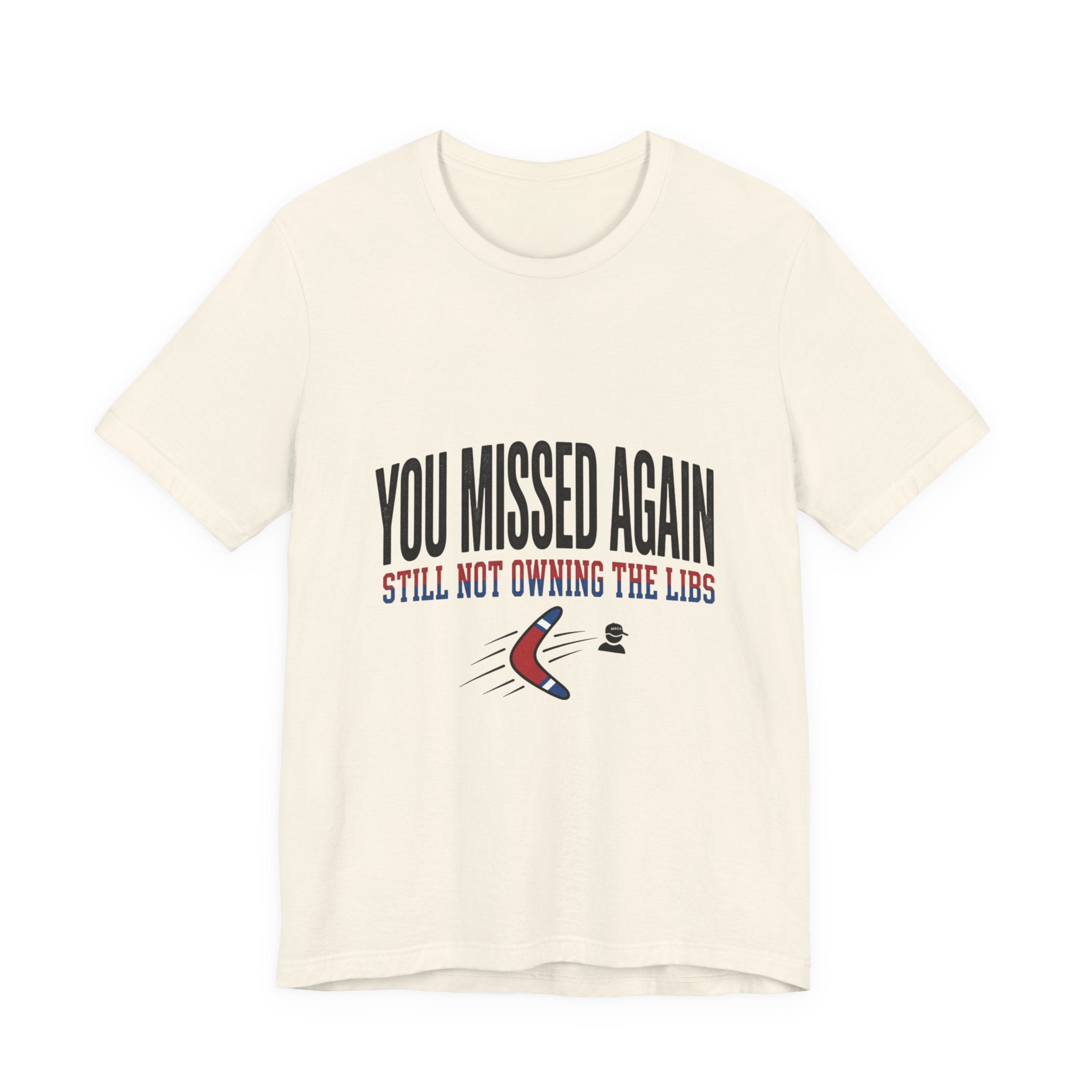 A cream-colored crew neck t-shirt featuring the text You Missed Again Still Not Owning The Libs.