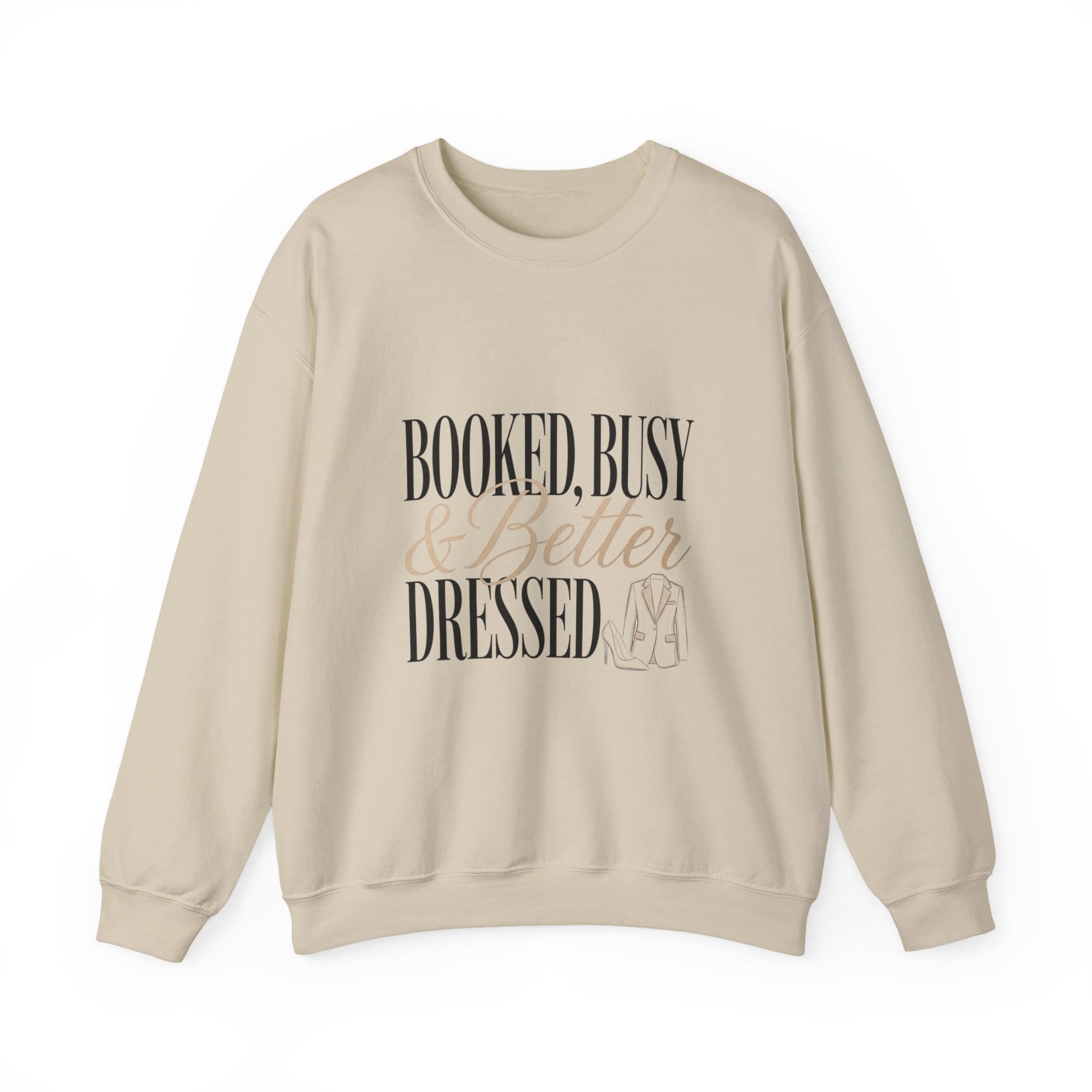 A beige crewneck sweatshirt featuring the text Booked, Busy and Better Dressed with a blazer icon.