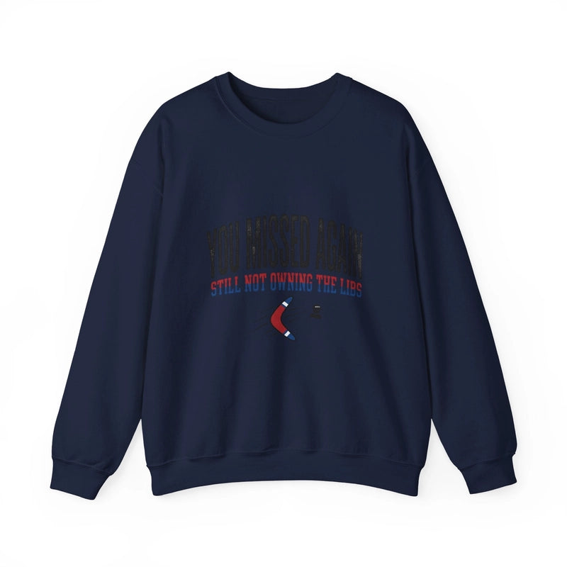 A navy blue crewneck sweatshirt featuring the text YOU MISSED AGAIN and a red and blue boomerang.