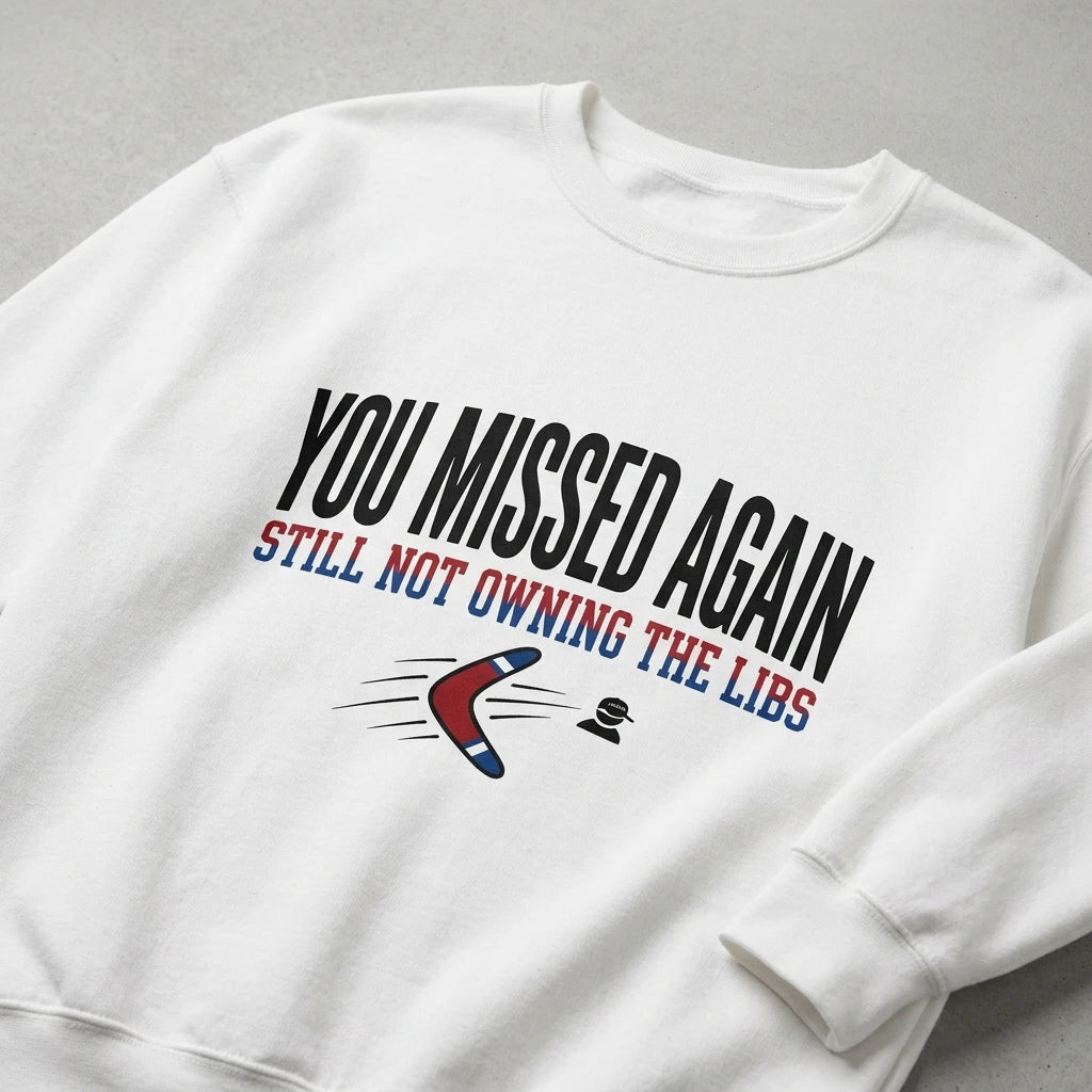 A white crewneck sweatshirt featuring the text You Missed Again Still Not Owning The Libs.