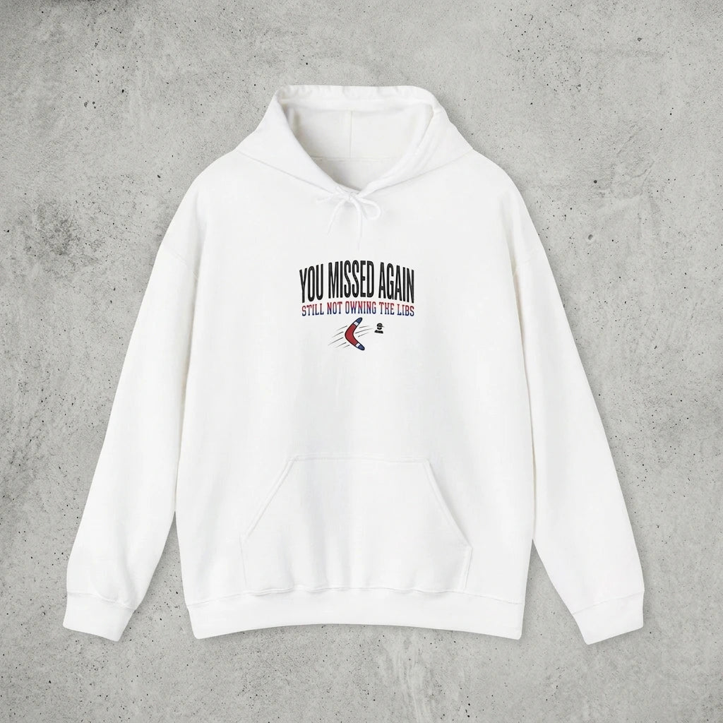 A white hooded sweatshirt featuring the text You Missed Again and a boomerang graphic.