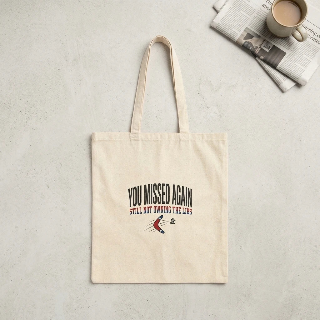 A natural canvas tote bag featuring the text You Missed Again and a boomerang graphic.